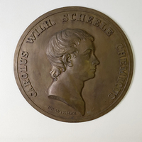 Medaljong, Scheele