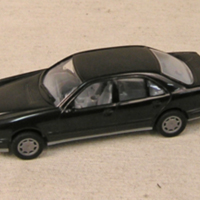 SLM 33360 - Leksaksbil av svart plast, från 1980-talet