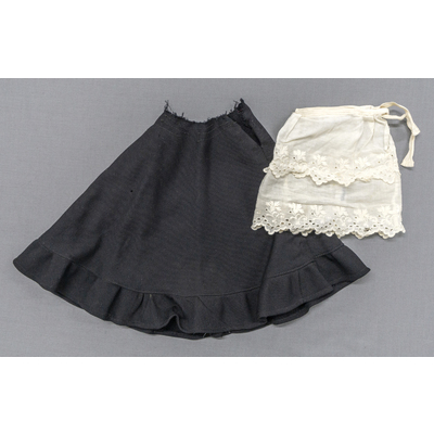 SLM 54718, 54752 - Dockkläder, svart kjol och en underkjol, troligen 1930 - 40-tal