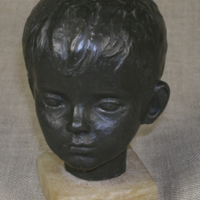 SLM 28121 - Skulptur av brons, barnhuvud av Britta Nehrman