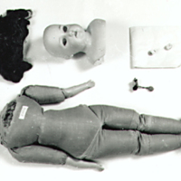 SLM 23542 - Docka med porslinshuvud märkt Armand Marseille, tygkropp med armar av celluloid