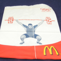 SLM 33760 7-8 - Påse av papper, motiv med tyngdlyftare, McDonald's 2005