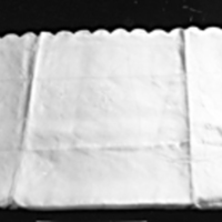 SLM 24682 - Örngott av linne, kantad med uddar och monogram FS