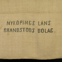 SLM 22645 - Säck, handvävd av blångarn, tryckt med Nyköpings läns Brandstodsbolag
