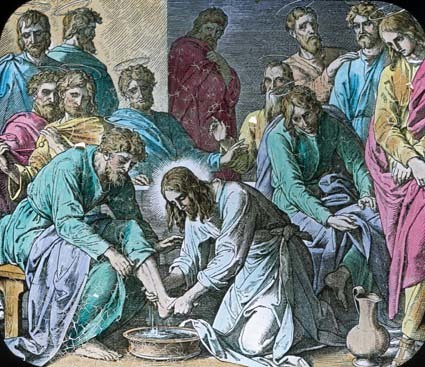 Jesus washing his disciples feet.