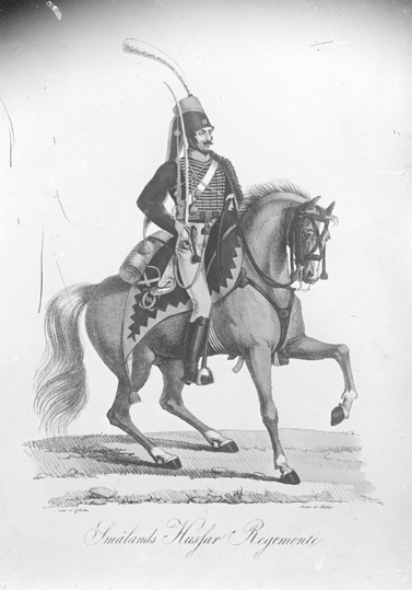 Avfotograferad bild av en ryttare till häst. 